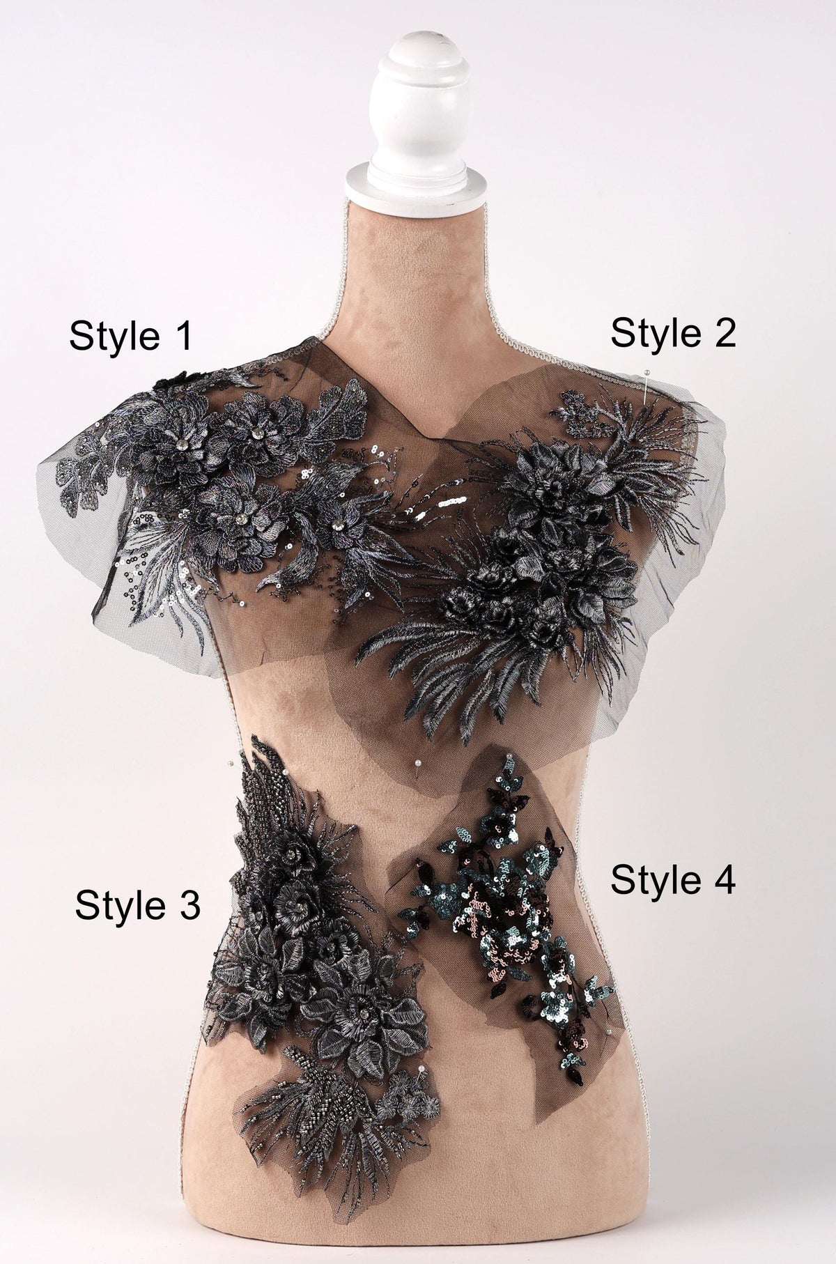 A mannequin with various decorative elements on its torso, including floral and sequin embellishments.