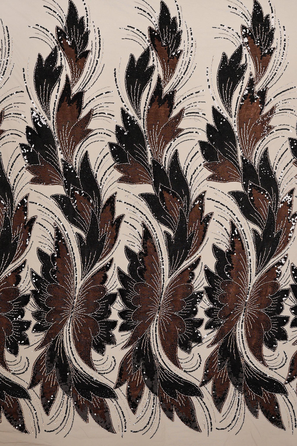 a repeating pattern of stylized brown and black flowers or leaves with intricate designs and patterns.