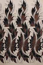 a repeating pattern of stylized brown and black flowers or leaves with intricate designs and patterns.