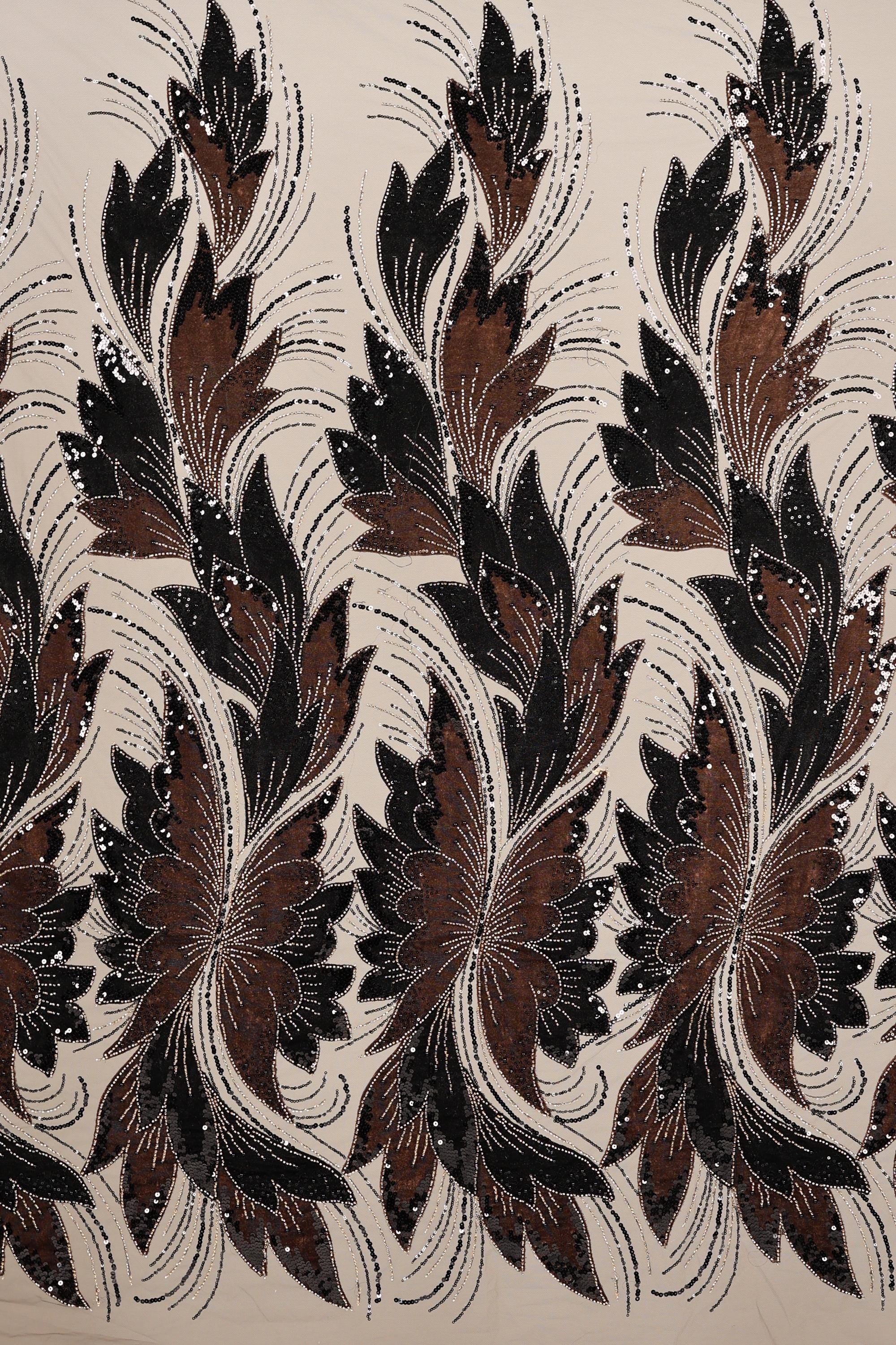 a repeating pattern of stylized brown and black flowers or leaves with intricate designs and patterns.
