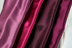 a close-up view of a fabric with a variety of colors, including shades of purple and pink.