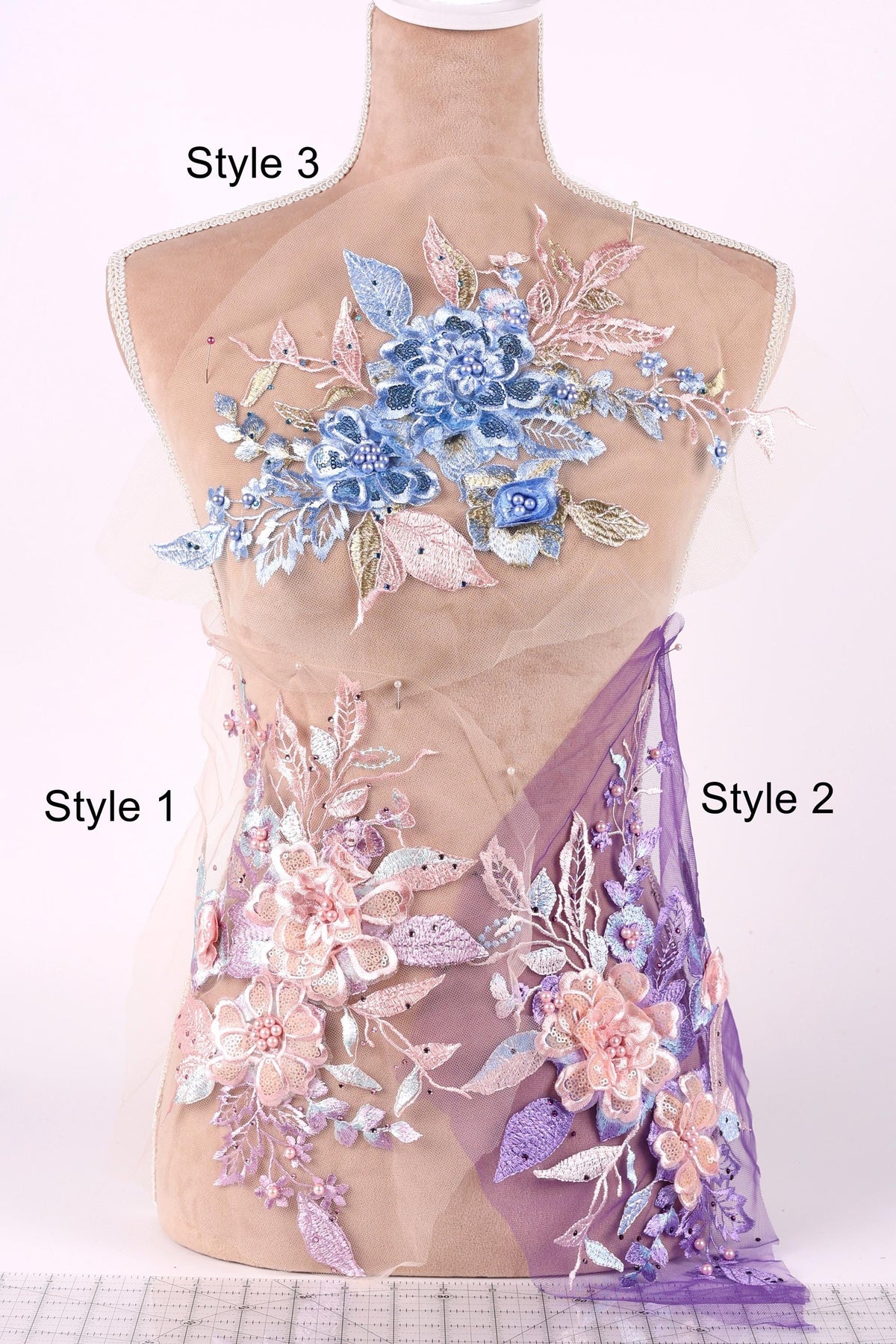 A mannequin with a floral design on its bust, featuring a combination of blue and pink flowers, leaves, and other decorative elements. The mannequin is labeled with the styles "Style 3" and "Style 1" and "Style 2", indicating different designs or patterns.