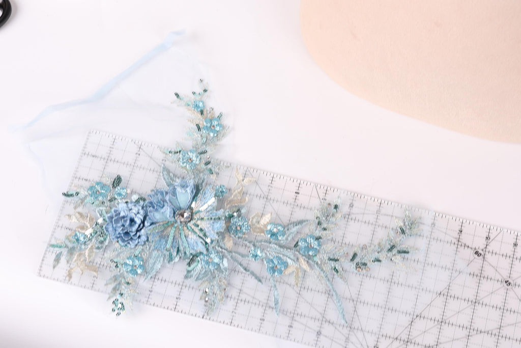 a clear ruler with a floral design on it, placed on a white surface.