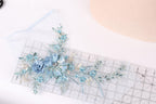 a clear ruler with a floral design on it, placed on a white surface.