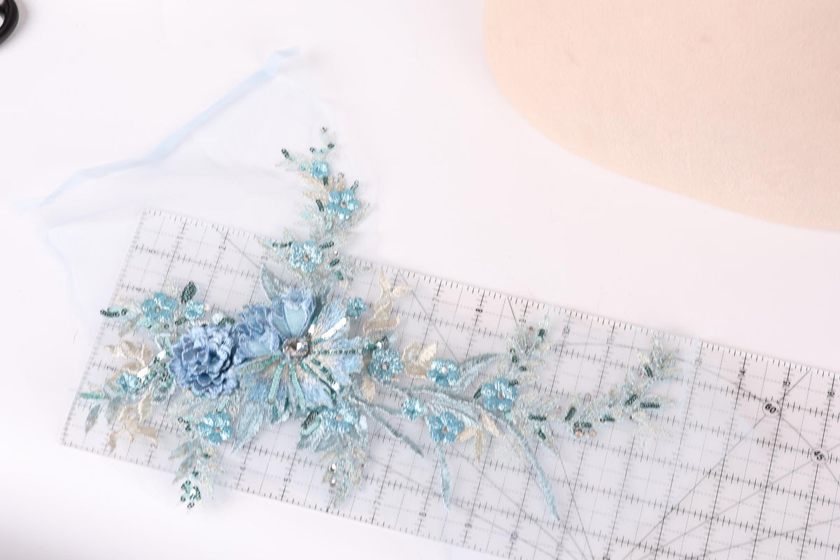 a clear ruler with a floral design on it, placed on a white surface.
