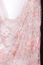 a delicate, pink floral fabric with a floral pattern.