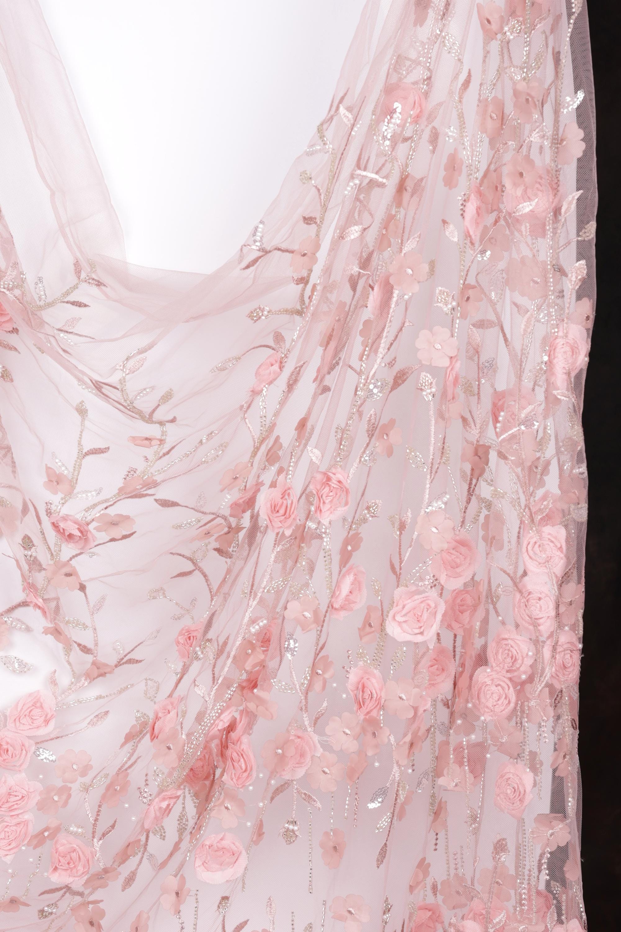 a delicate, pink floral fabric with a floral pattern.