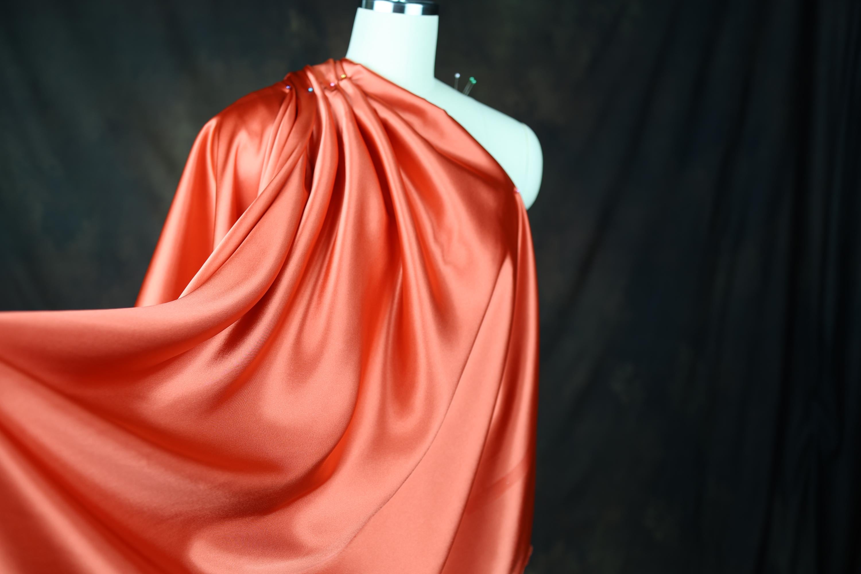 a mannequin dressed in a red cape