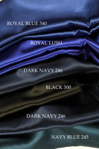 five different colored satin fabrics, each labeled with a color name: Royal Blue 340, Royal Lush, Dark Navy 246, Black 300, and Navy Blue 245.