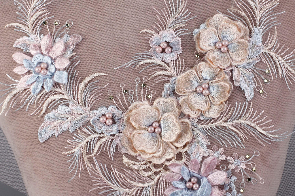 a close up of a dress with flowers on it