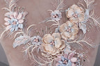 a close up of a dress with flowers on it