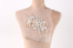 A mannequin with a delicate floral embroidered on its bust.