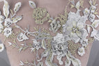 a close up of a dress with flowers on it