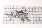 a clear ruler with a floral pattern printed on it.