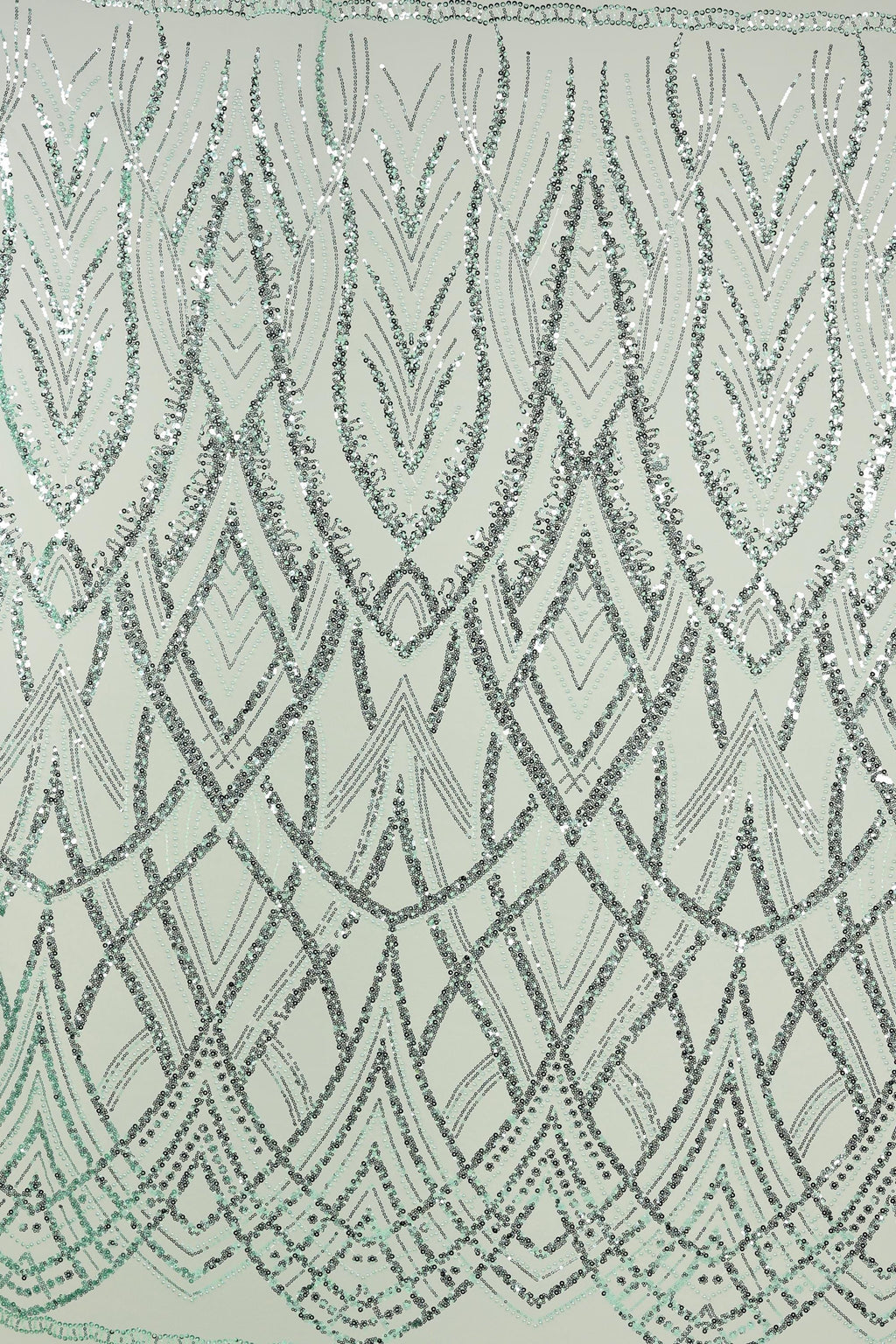 a repeating pattern of geometric shapes and lines in shades of gray and white, creating a visually striking and intricate design.