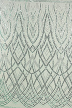 a repeating pattern of geometric shapes and lines in shades of gray and white, creating a visually striking and intricate design.