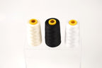 Three spools of thread in white, black, and white are displayed on a clear stand against a white background.