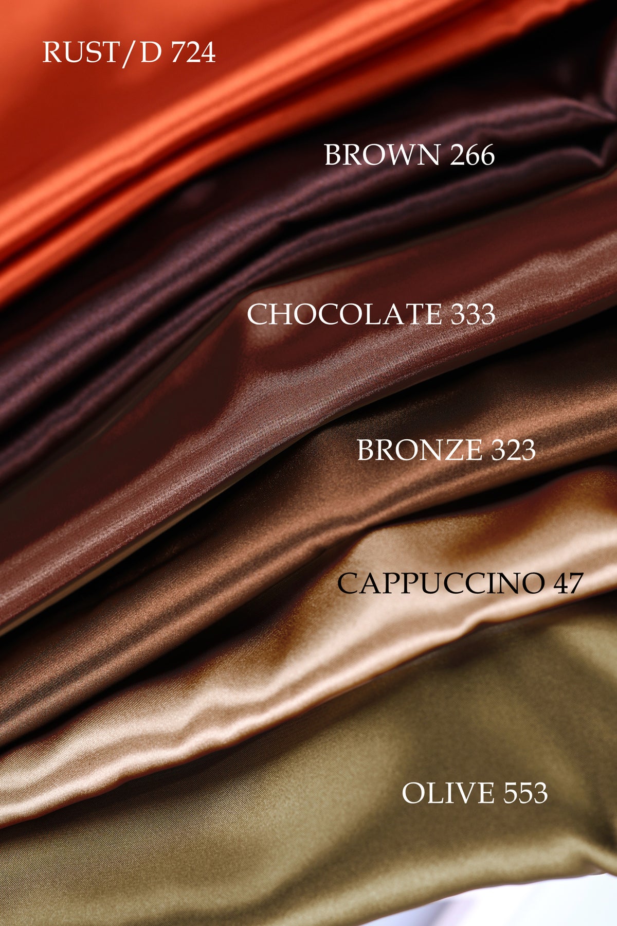 a collection of five different colored silks, each with a unique color and texture, arranged in a visually appealing manner.