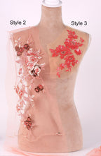 A mannequin with a pink floral design on its torso, featuring a combination of red and pink flowers. The mannequin is labeled with the styles "Style 2" and "Style 3".