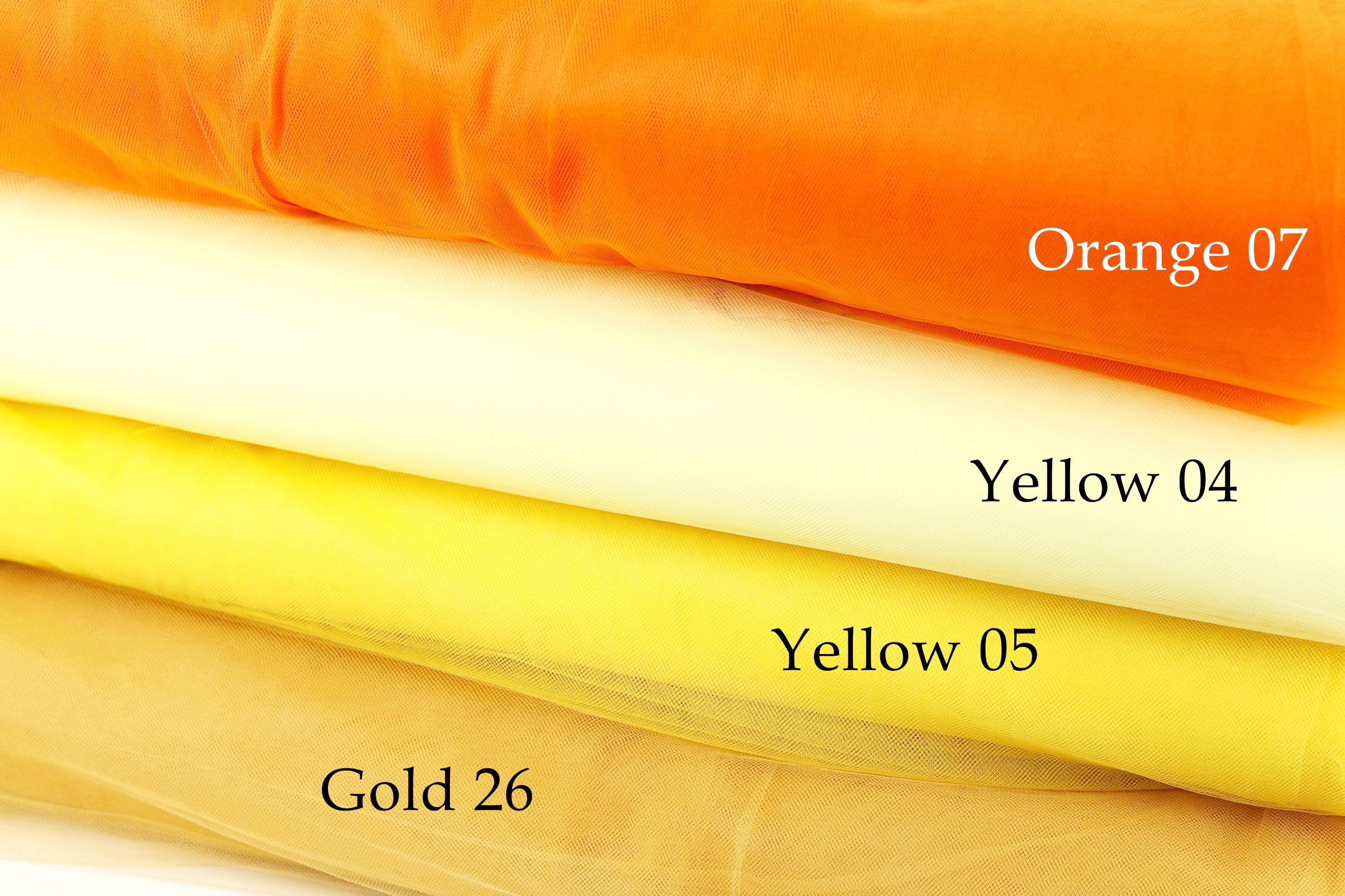 a stack of fabric swatches in various colors, including orange, yellow, and gold.