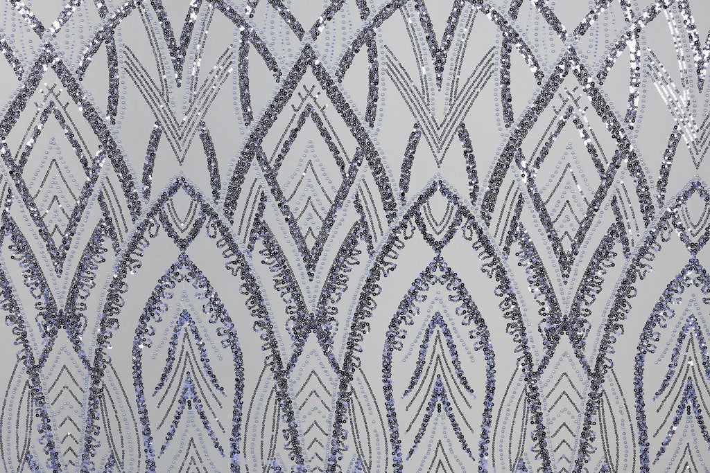 a repeating pattern of diamond-shaped sequins in shades of blue and gray, creating a visually striking and intricate design.