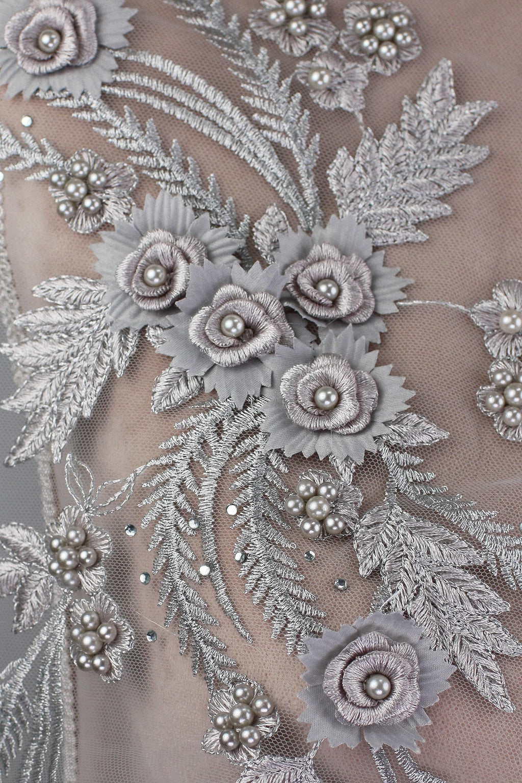 a close up of a dress with flowers on it