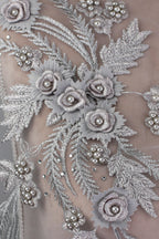 a close up of a dress with flowers on it