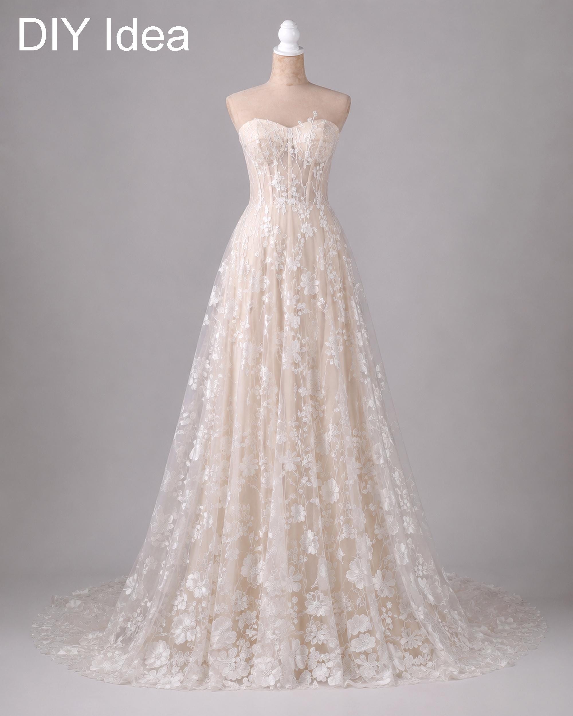 A beautiful, lace wedding dress with a long train and a sweetheart neckline, displayed on a mannequin.