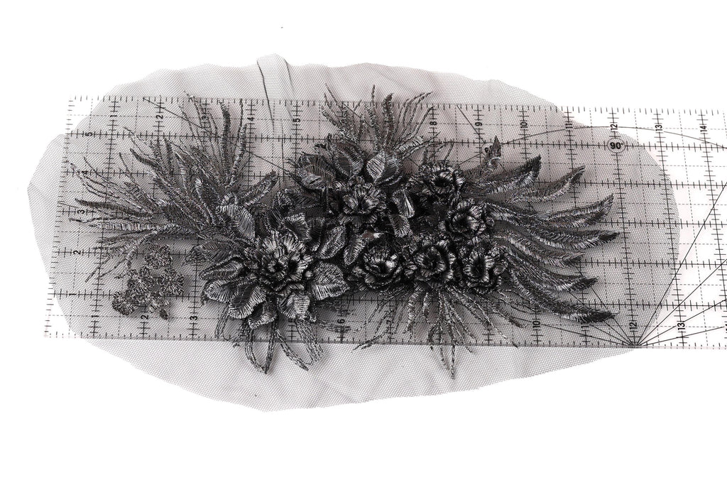 a close-up view of a decorative metal piece with intricate floral designs.