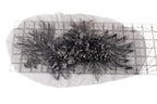 a close-up view of a decorative metal piece with intricate floral designs.