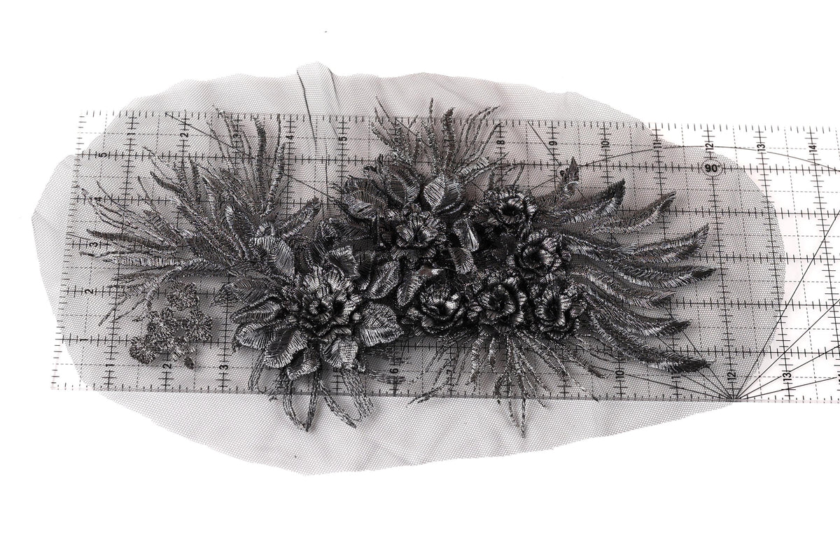 a close-up view of a decorative metal piece with intricate floral designs.
