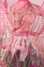 a pink and green dress with intricate embroidered patterns and sequins.