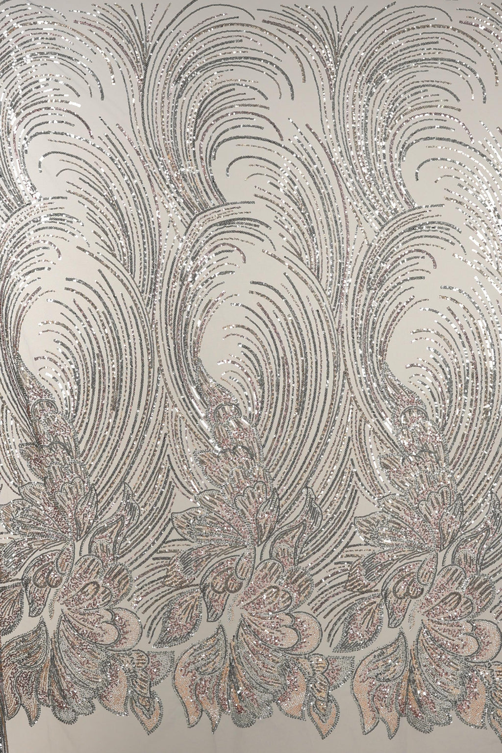 a repeating pattern of intricate, swirling lines and shapes in shades of gray and white, creating a visually striking and dynamic design.