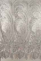 a repeating pattern of intricate, swirling lines and shapes in shades of gray and white, creating a visually striking and dynamic design.