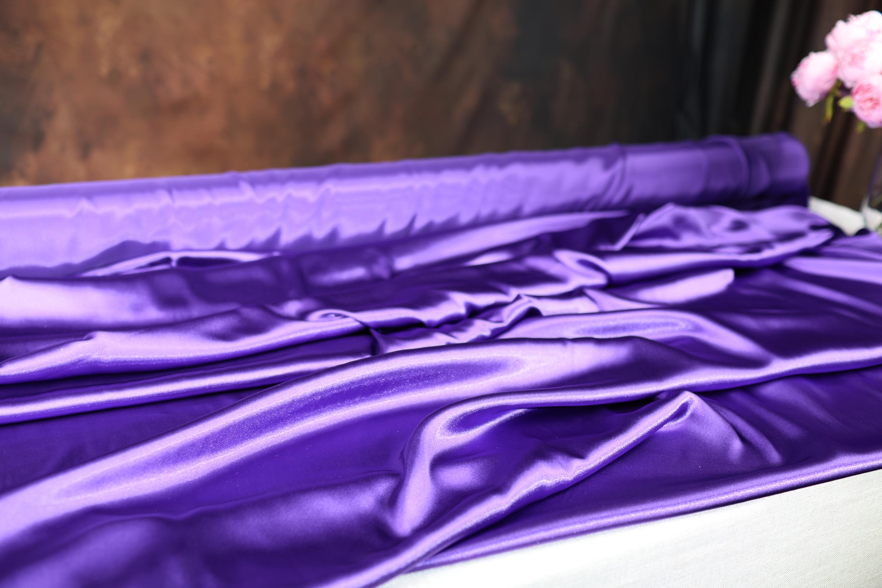 a vase of flowers sitting on top of a bed