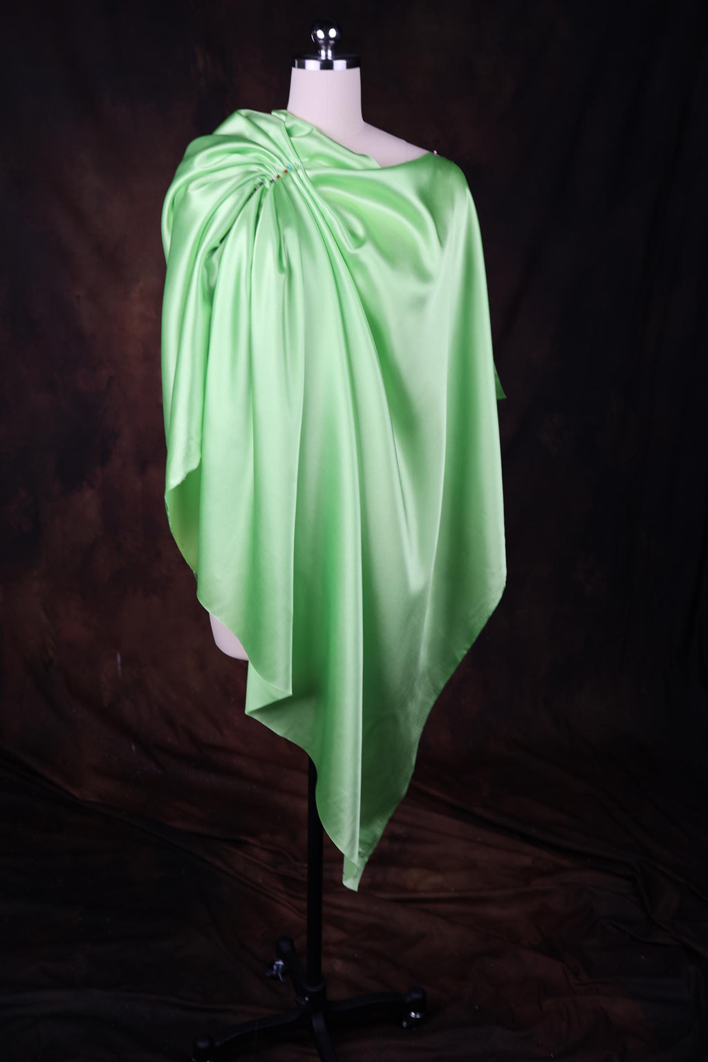 a dress on a mannequin on a black background