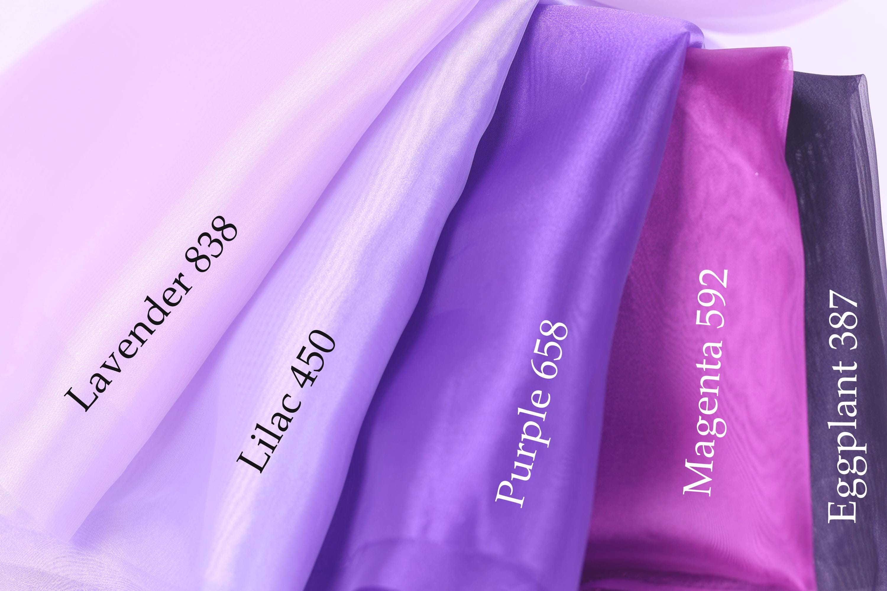 a collection of fabric swatches in various colors, including lavender, lilac, purple, and eggplant.