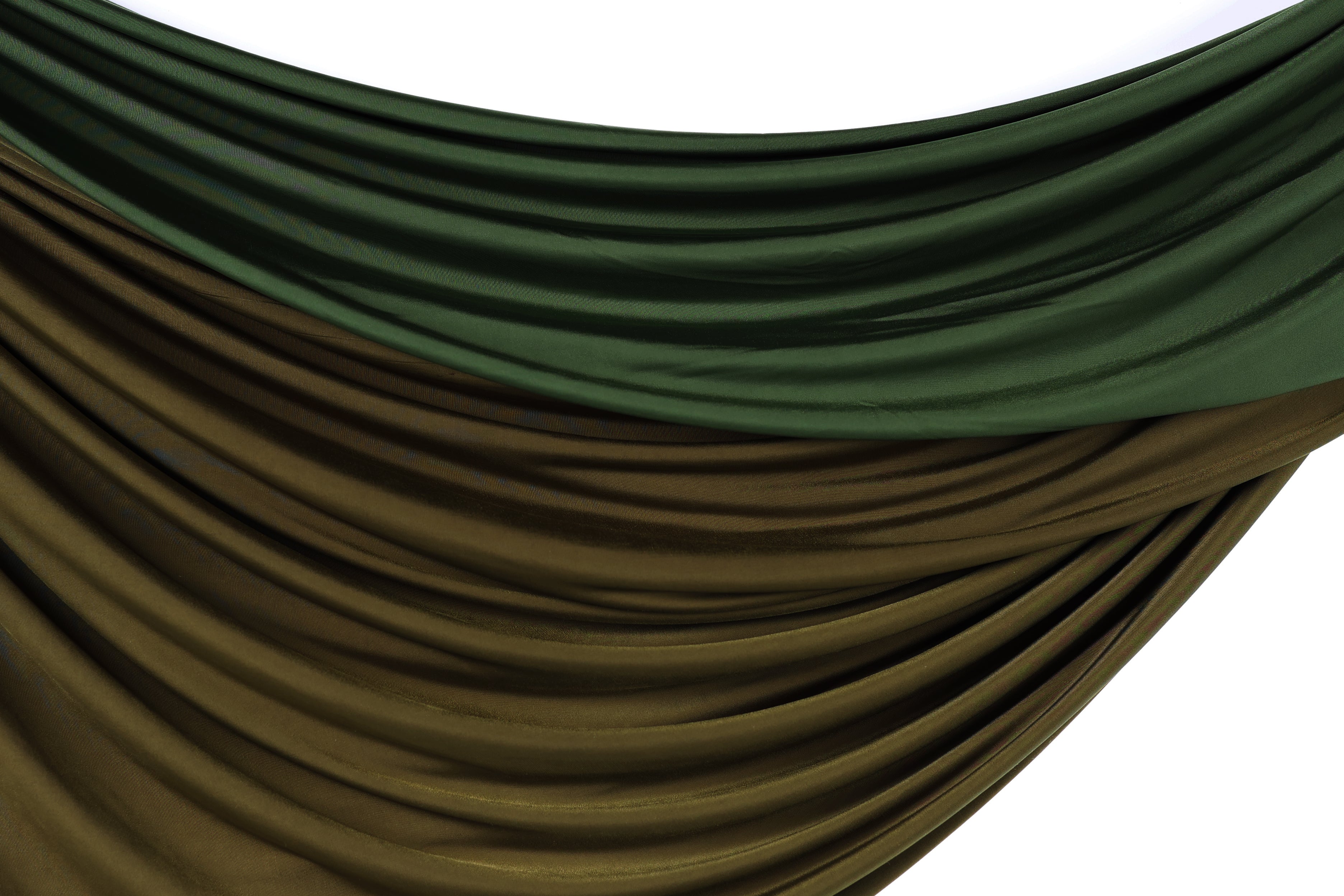 a close-up view of a fabric with a gradient of green and brown colors, creating a visually appealing and textured appearance.