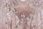 a dress with a pink and white floral pattern, adorned with sequins and delicate lace-like details.