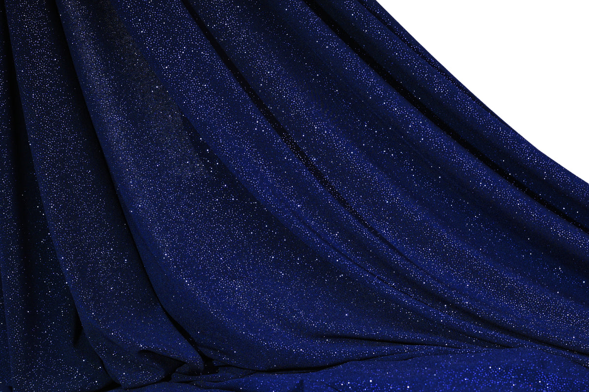 a close-up view of a dark blue fabric with a glittery texture, creating a shiny and sparkly appearance.