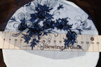 a ruler with some blue flowers on it