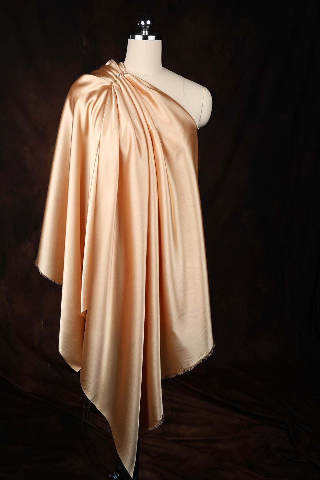 a dress on a mannequin on a black background