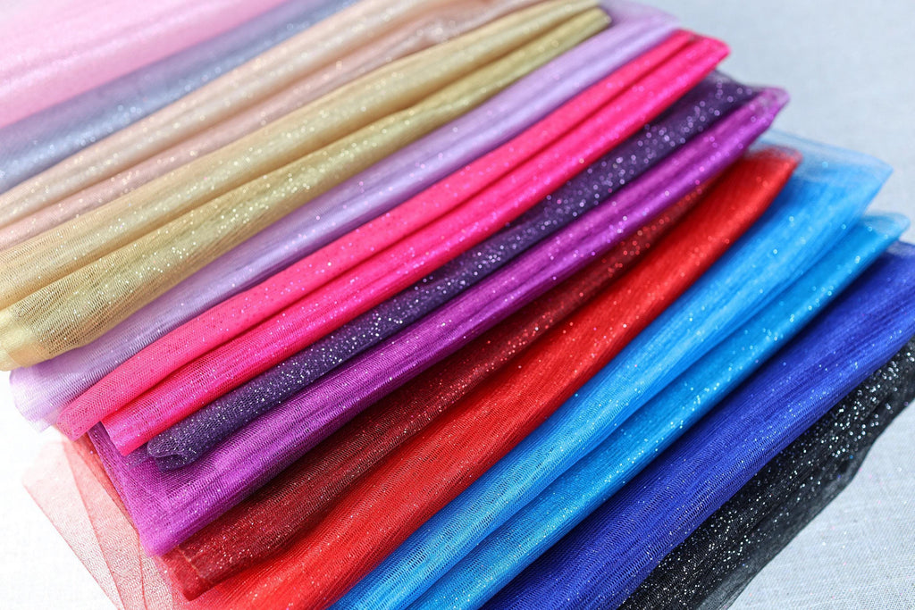 a stack of different colored cloths sitting on top of each other
