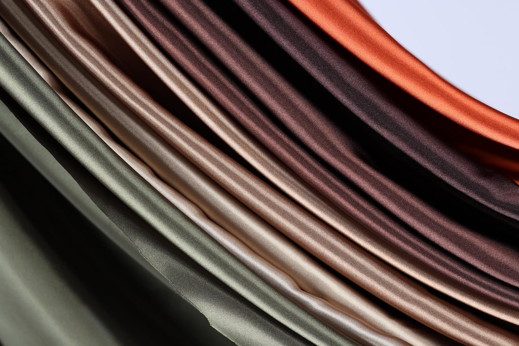 a close-up view of a collection of colorful, folded fabric pieces arranged in a visually appealing manner.