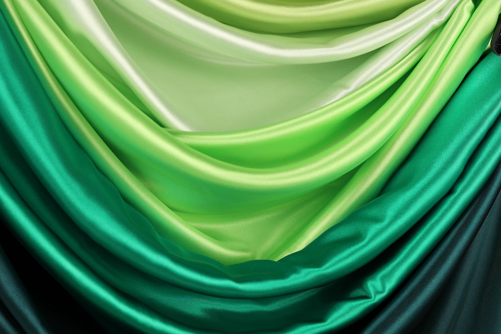 a close-up view of a fabric with a gradient of green and white colors, creating a visually appealing and textured appearance.