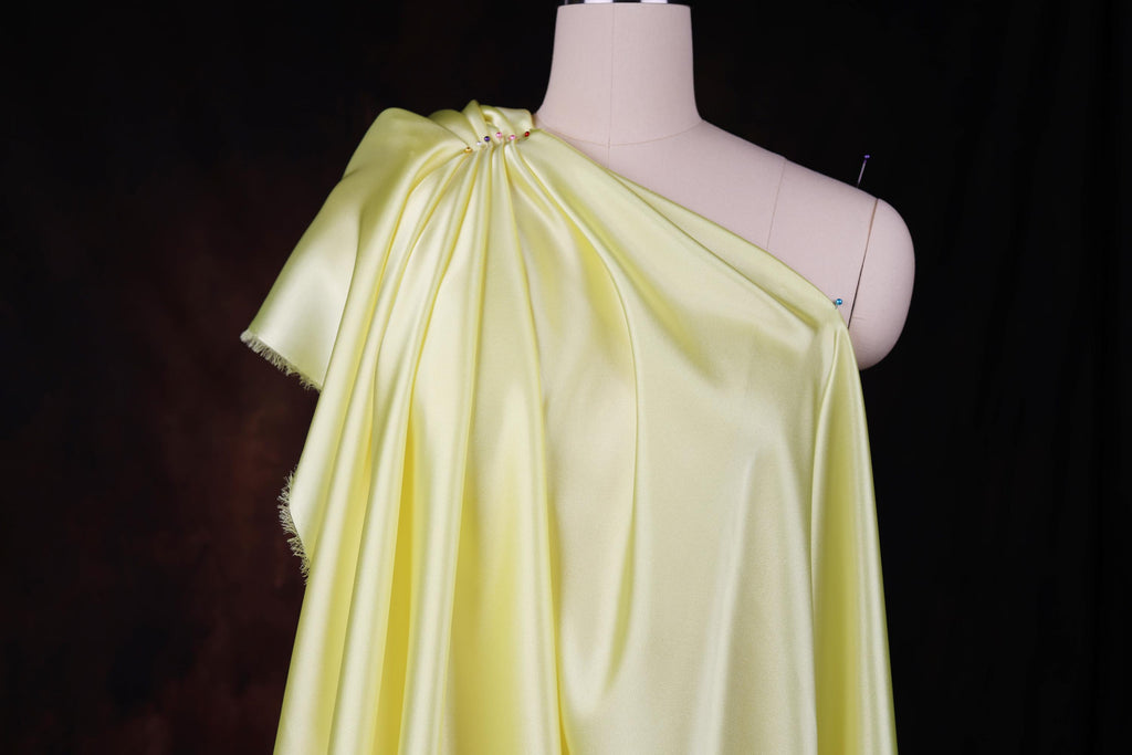 a dress on a mannequin with a black background