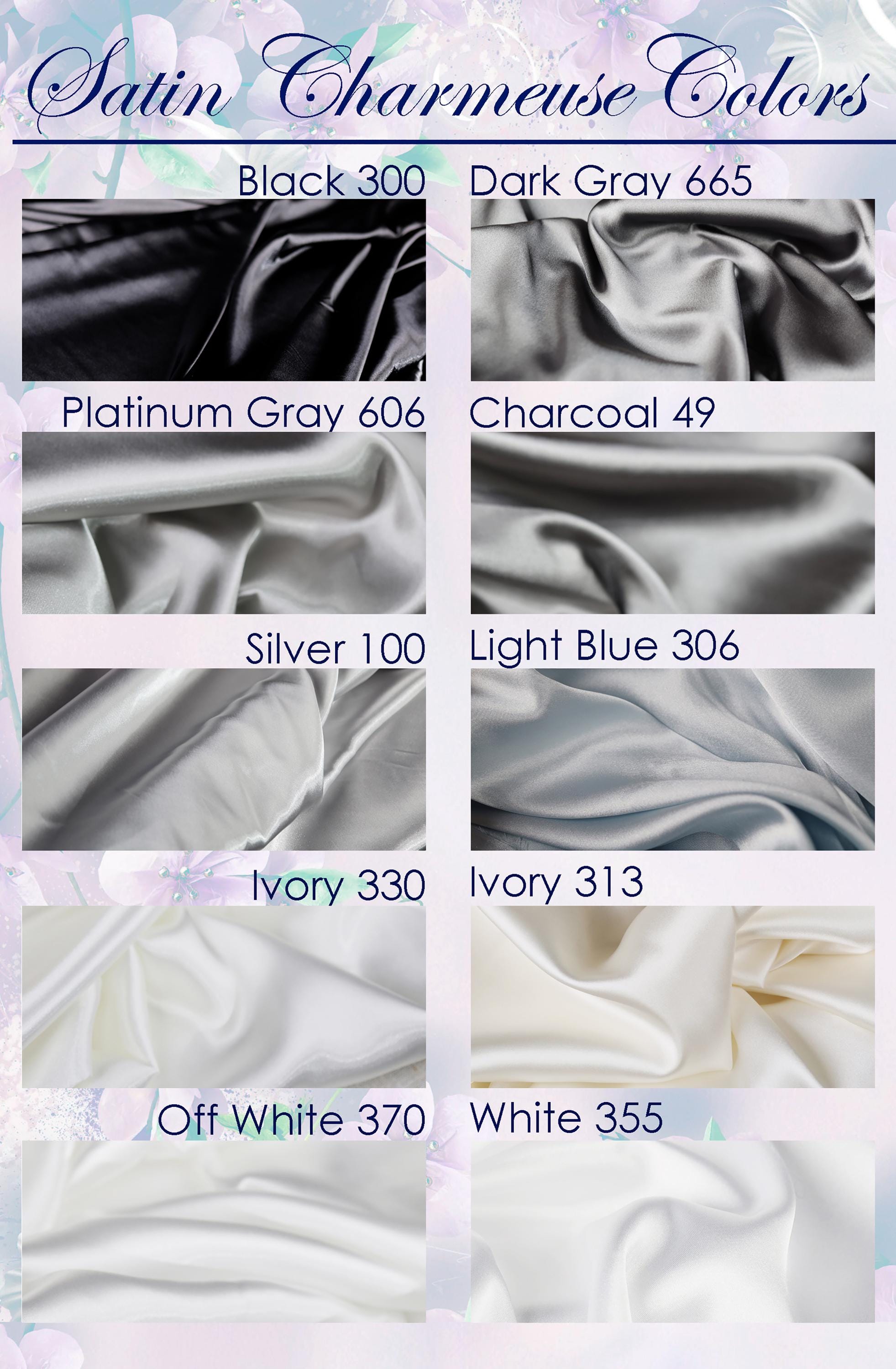 a collection of different satin fabrics in various colors, including black, dark gray, charcoal, silver, light blue, ivory, and off-white.