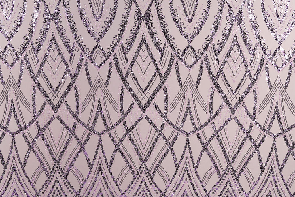 a repeating pattern of purple and black diamond shapes on a light pink background.