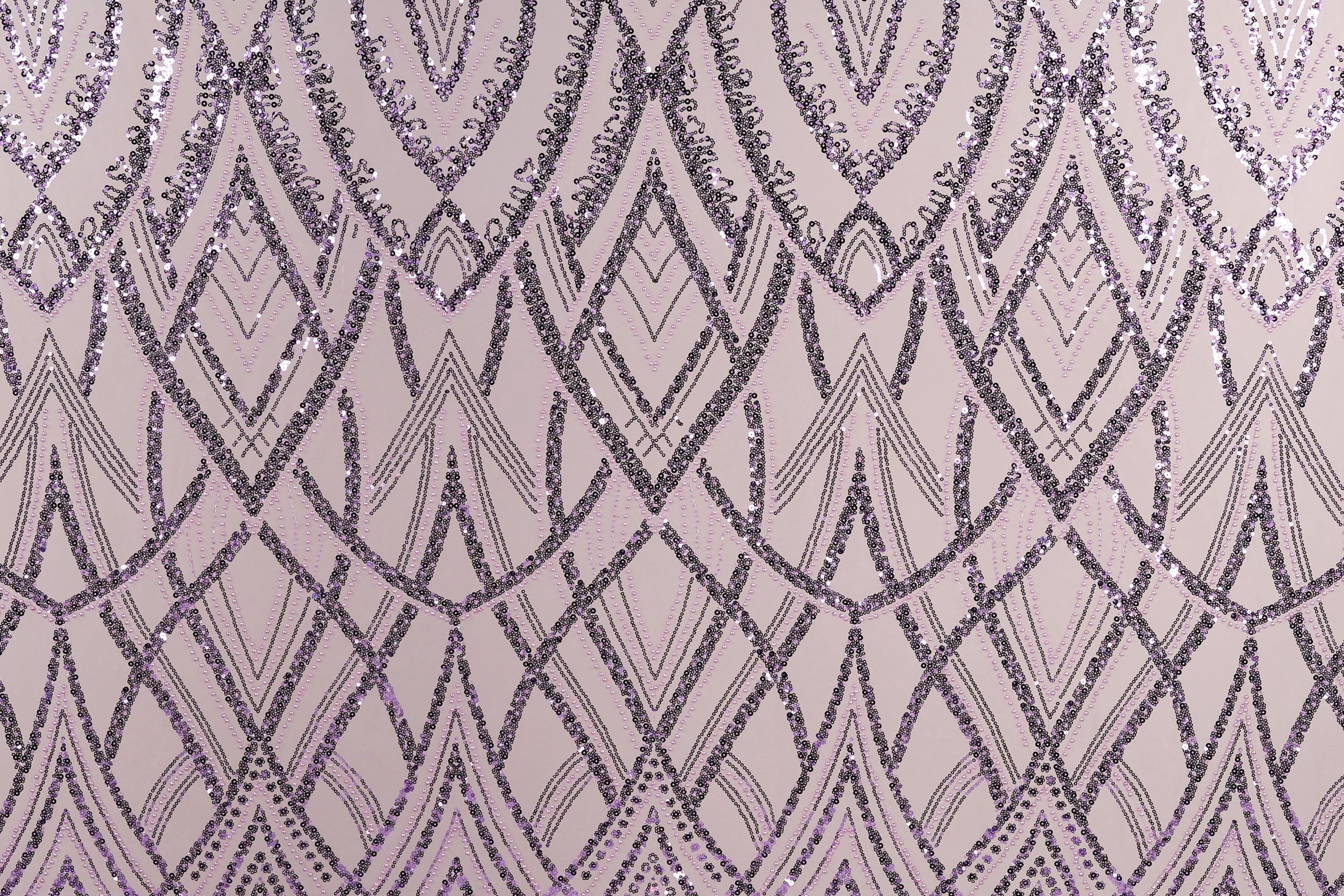 a repeating pattern of purple and black diamond shapes on a light pink background.