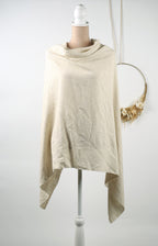 A beige shawl draped over a mannequin torso, displayed on a white mannequin stand against a white background.